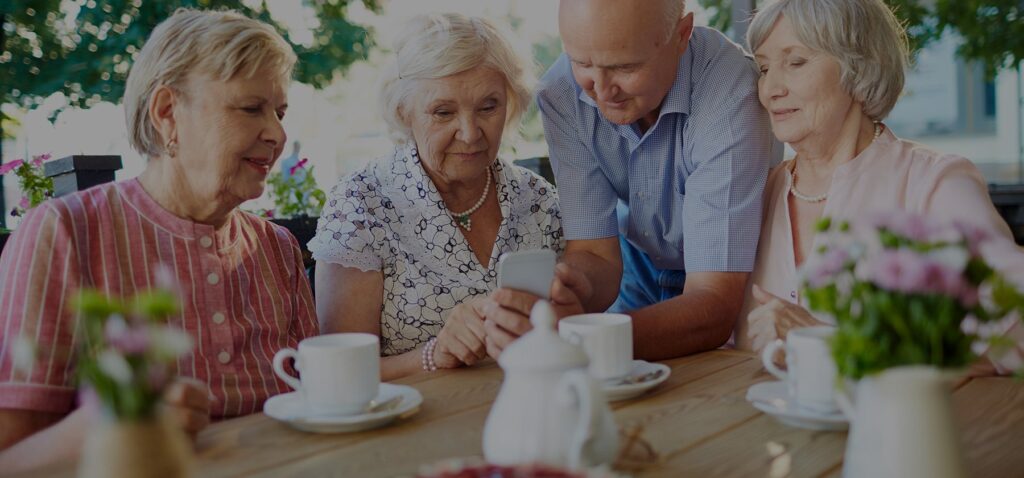 senior citizen having tea in community